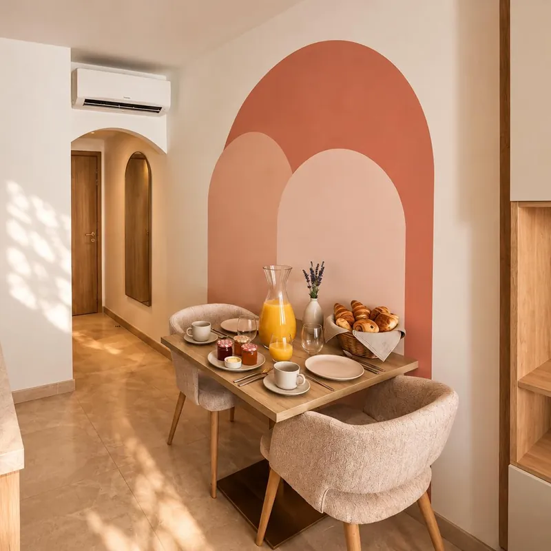 Coin petit-déjeuner d'un appartement, fresque en arche terracotta